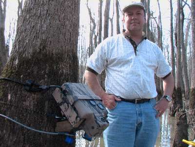 Robert Henderson with another of the remote cameras